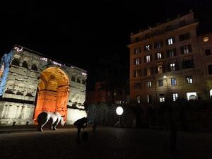 The 4th Century Arch of Janus (L) and the Palazzo Rhinoceros (R), the new building of the Alda Fendi-Esperimenti Foundation dedicated to arts, are pictured. (File/AFP)