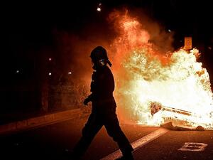 Protests erupted across Italy and Spain last night as thousands of angry demonstrators called on their Governments to reconsider a second-round of lockdown restrictions. Vast crowds gathered on the streets of Barcelona with angry protesters setting dustbins on fire  (AFP)