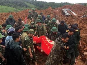 Rocks rained down on the barracks of a military station in Quang Tri province, with 22 soldiers believed to have been buried underneath thick mud. (AFP)