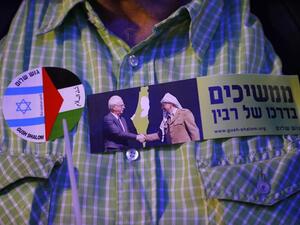 In this file photo taken on November 4, 2017, a demonstrator attends a rally to mark the 22nd anniversary of the assassination of former Israeli prime minister Yitzhak Rabin, at Rabin Square in Tel Aviv. JACK GUEZ / AFP
