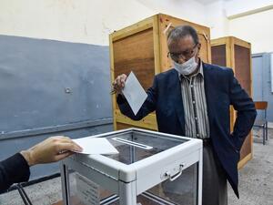 An Algerian man casts his ballot at a polling station in the capital Algiers during a vote for a revised constitution, on November 1, 2020. Polls opened in Algeria today for a vote on a revised constitution the regime hopes will neutralise a protest movement which at its peak last year swept long-time president Abdelaziz Bouteflika from power. RYAD KRAMDI / AFP