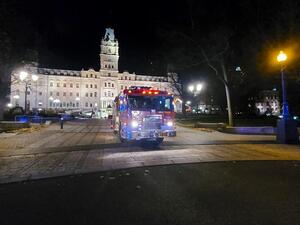 A firefighter truck is parked in front of the National Assembly of Quebec, in Quebec City, early on November 1, 2020, after two people were killed and five wounded by a sword-wielding suspect dressed in medieval clothing. (AFP)