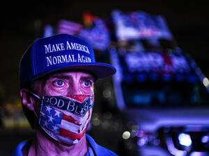 Andy Soberon a supporter of the Democratic party attends a watch party in Miami, Florida on November 3, 2020. The US is voting Tuesday in an election amounting to a referendum on Donald Trump's uniquely brash and bruising presidency, which Democratic opponent and frontrunner Joe Biden urged Americans to end to restore "our democracy." CHANDAN KHANNA / AFP