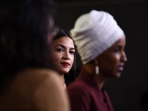 In this file photo taken on July 15, 2019 US Representatives Ilhan Omar (D-MN) speaks as Alexandria Ocasio-Cortez (D-NY) (C) looks on during a press conference, to address remarks made by US President Donald Trump earlier in the day, at the US Capitol in Washington, DC. New York progressive Alexandria Ocasio-Cortez comfortably secured a second term in Congress on November 3, 2020 with an expected win over her Republican challenger who was outspent despite raising $10 million. Ocasio-Cortez is part of a quar