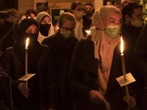 People attend a candlelight vigil remembering the victims of the terrorist attack in Vienna, Austria on November 5, 2020. Austria is mourning four civilians shot dead by a 20-year-old Islamic State sympathiser who attacked a popular nightlife area in the heart of Vienna on November 2, 2020, on the last night before a second coronavirus shutdown.  JOE KLAMAR / AFP