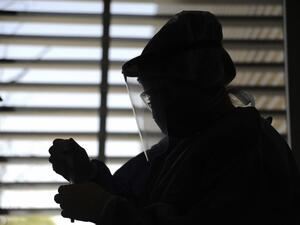 Nurse Micaela Barrionuevo works at the COVID-19 sample collection area of the Central Hospital in Mendoza, Argentina, on November 6, 2020, amid the new coronavirus pandemic. (AFP)
