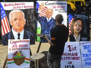 A painter gives the final touches to a painting depicting newly elected US President Joe Biden, in Mumbai on November 8, 2020. INDRANIL MUKHERJEE / AFP