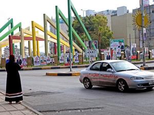 Vehicles drive past electoral banners for candidates and lists running in the 2020 general election in Jordan's northern Irbid on the day of the vote November 10, 2020. AFP