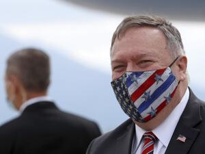 In this file photo taken on October 02, 2020 US Secretary of State Mike Pompeo wears a face mask as he arrives at the airport in Dubrovnik as part of his six-day trip to Southern Europe. Secretary of State Mike Pompeo on November 10, 2020 promised the world a "smooth transition" after US elections but refused to recognize President-elect Joe Biden's victory, saying Donald Trump will remain in power. Darko Bandic / POOL / AFP