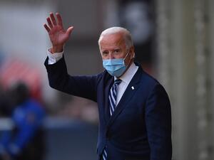 US President-elect Joe Biden waves as he leaves The Queen in Wilmington, Delaware, on November 10, 2020. President-elect Joe Biden said November 10, 2020 he had told several world leaders that "America is back" after his defeat of Donald Trump in last week's bitterly contested US election. Angela Weiss / AFP