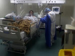 A nurse takes care of a COVID-19 patient in the intensive care unit of the Rafic Hariri University Hospital in the Lebanese capital Beirut, on November 13, 2020. In Lebanon, where hospital capacity has been saturated, coronavirus infections crossed the 100,000 mark as the country prepared to enter a new two-week lockdown. The health ministry said the number of people who have tested positive with Covid-19 had reached 100,703, including 775 deaths.  JOSEPH EID / AFP