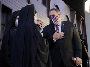 U.S. Secretary of State Mike Pompeo (R) gestures as he speaks with Ecumenical Patriarch Bartholomew I, the spiritual leader of the world's Orthodox Christians, as he departs The Patriarchal Church of St. George in Istanbul on November 17, 2020. AFP