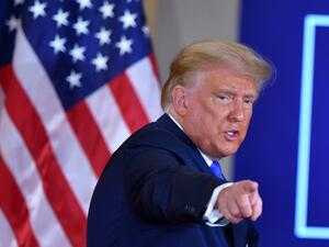 In this file photo US President Donald Trump gestures after speaking during election night in the East Room of the White House in Washington, DC, early on November 4, 2020. Two months before he is due to leave office, President Donald Trump asked top aides about the possibility of striking Iran's nuclear facilities, The New York Times reported on November 16, 2020. During a meeting at the Oval Office last November 12, 2020, the outgoing Republican leader asked several top aides, including Vice President Mik