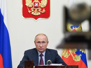 Russian President Vladimir Putin looks on during a meeting with members of the government via teleconference call at Novo-Ogaryovo state residence, outside Moscow, on November 18, 2020. Alexey NIKOLSKY / Sputnik / AFP