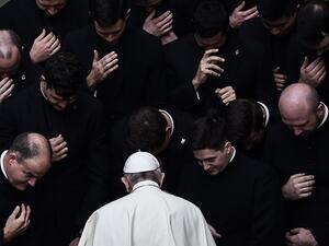 Pope Francis prays with priests at the end of a limited public audience at the San Damaso courtyard in The Vatican on September 30, 2020 during the COVID-19 infection, caused by the novel coronavirus. Filippo MONTEFORTE / AFP