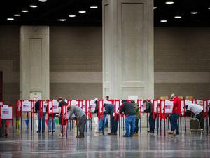  Voters stand in ballot boxes at the Kentucky Exposition Center on November 3, 2020 in Louisville, Kentucky. After a record-breaking early voting turnout, Americans head to the polls on the last day to cast their vote for incumbent U.S. President Donald Trump or Democratic nominee Joe Biden in the 2020 presidential election. Jon Cherry/Getty Images/AFP