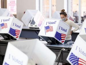 Americans head to the polls on the last day to cast their vote for incumbent U.S. President Donald Trump or Democratic nominee Joe Biden in the 2020 presidential election. Michael Ciaglo/Getty Images/AFP