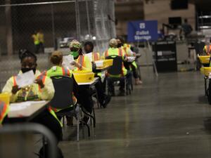 Election workers count ballots on November 03, 2020 in Philadelphia, Pennsylvania. After a record-breaking early voting turnout, Americans headed to the polls today on the last day to cast their vote for incumbent U.S. President Donald Trump or Democratic nominee Joe Biden in the 2020 presidential election. Spencer Platt/Getty Images/AFP SPENCER PLATT / GETTY IMAGES NORTH AMERICA / Getty Images via AFP