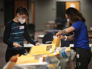 Election officials count absentee ballots on November 04, 2020 in Milwaukee, Wisconsin. Wisconsin requires election officials to wait to begin counting absentee ballots until after polls open on election day. The Milwaukee count was finished about 3AM. Scott Olson/Getty Images/AFP