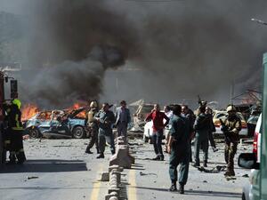 Security forces arrive at the site of a car bomb attack in Kabul. —AFP