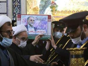 The coffin of Iran's assassinated top nuclear scientist Mohsen Fakhrizadeh carried during funeral procession at Fatima Masumeh's Shrine in Qom, south of Tehran. November 29, (AFP)