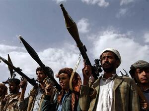 Houthi rebels gather on the outskirts of Sanaa in June 2016 (AFP)