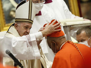 Archbishop Wilton Gregory of Washington, D.C., becomes a cardinal during a ceremony Saturday known as a consistory in St. Peter's Basilica at the Vatican. Pope Francis cautioned new cardinals never to lose their connection to the people. Fabio Frustaci/Pool/AFP via Getty Images