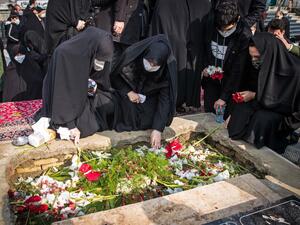 Iranian mourners attend the burial ceremony of slain nuclear scientist Mohsen Fakhrizadeh at Imamzadeh Saleh shrine in northern Tehran, on November 30, 2020. HAMED MALEKPOUR / TASNIM NEWS / AFP