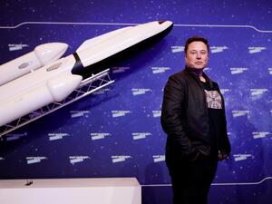 SpaceX owner and Tesla CEO Elon Musk arrives on the red carpet for the Axel Springer Awards ceremony, in Berlin, on December 1, 2020. HANNIBAL HANSCHKE / POOL / AFP
