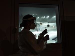 A nurse holds a swab test at the Covid Testing Position organized by the International Ski Federation (FIS) on the eve of its World Cup event on December 4, 2020 in Santa Caterina Valfurva, Northern Italy. Marco Bertorello / AFP