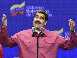 Venezuelan President Nicolas Maduro gestures while delivering a press conference at a polling station in the Simon Rodriguez school in Fuerte Tiuna, Caracas, on December 6, 2020 during Venezuela's legislative elections. AFP