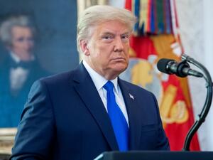 US President Donald Trump looks on during a ceremony presenting the Presidential Medal of Freedom to wrestler Dan Gable in the Oval Office of the White House in Washington, DC on December 7, 2020. SAUL LOEB / AFP