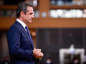 Greece's Prime Minister Kyriakos Mitsotakis speaks to the press as he arrives at the EU headquarters' Europa building in Brussels on December 10, 2020, prior to a European Union summit. JOHN THYS / POOL / AFP