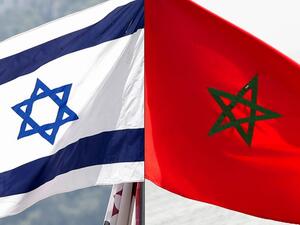 This combination of file pictures created on December 10, 2020 shows a Moroccan flag off the coasts of the city of Cayenne on March 21, 2012 and an Israeli national flag on September 23, 2020. Morocco confirmed on December 10, 2020 it would resume diplomatic relations with Israel "with minimal delay" and lauded as "historic" a decision by Washington to recognise Moroccan sovereignty over the disputed Western Sahara region. JACK GUEZ, Jody AMIET / AFP