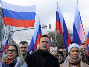  In this file photo taken on February 29, 2020 Russian opposition leader Alexei Navalny, his wife Yulia, opposition politician Lyubov Sobol and other demonstrators take part in a march in memory of murdered Kremlin critic Boris Nemtsov in downtown Moscow on February 29, 2020. Navalny, 44, was hospitalised in the Russian city of Omsk after he collapsed on a flight from Siberia to Moscow in August 2020 and then transported by medical aircraft to Berlin. Chemical weapons experts from Russia's Federal Security 