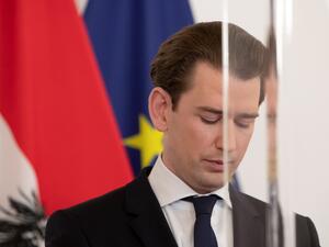 Austrian Federal Chancellor Sebastian Kurz is seen through a plexiglass screen as he delivers a press statement after a video conference with the provincial governor about the further tightening of lockdown measures, at the Federal Chancellery in Vienna on December 18, 2020. Austria will enter its third coronavirus lockdown between December 26 and January 24, Chancellor Kurz announced on December 18, as the country fights to bring down its infection rate. ALEX HALADA / AFP