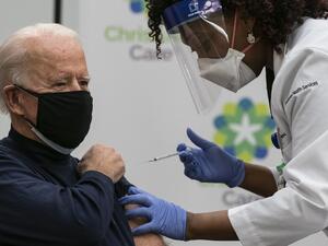 US President-elect Joe Biden receives a Covid-19 vaccination from Tabe Mase, Nurse Practitioner and Head of Employee Health Services, at the Christiana Care campus in Newark, Delaware on December 21, 2020.   ALEX EDELMAN / AFP