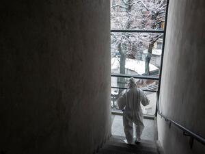 Doctor Marta Castagnotto, part of the USCA special care unit of ASL of Alba, walks down stairs at the Usca Clinic in San Lazzaro Hospital in Alba, on December 28, 2020, amid the crisis linked with the Covid-19 pandemic caused by the novel coronavirus. Marco Bertorello / AFP