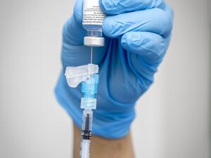 A healthcare worker prepares an injection of the Pfizer-BioNTech Covid-19 vaccine at St James's Hospital in Dublin on December 29, 2020. Ireland kicked off on December 29 its coronavirus vaccination programme with staff and pateints at four hospitals across the Republic being the first to recieve injections from the first delivery of 10,000 doses received by the Health Authorty on December 26. Marc O'Sullivan / POOL / AFP