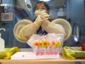A medical worker waits for the next individual to take a swab test for the COVID-19 coronavirus at a hospital in Beijing in December 30, 2020. Noel Celis / AFP