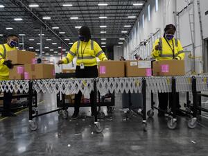 Boxes containing the Moderna COVID-19 vaccine are prepared to be shipped at the McKesson distribution center on December 20, 2020 in Olive Branch, Mississippi. The federal government plans to distribute over the coming week a total of 7.9 million doses of vaccines from Moderna and Pfizer Inc. Paul Sancya - Pool/Getty Images/AFP POOL / GETTY IMAGES NORTH AMERICA / Getty Images via AFP