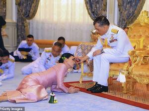 Thailand's King Maha Vajiralongkorn and Queen Suthida during their wedding ceremony in Bangkok in May last year. According to tradition, the King has a semi-divine status and must be seated higher than those around him. (AFP)