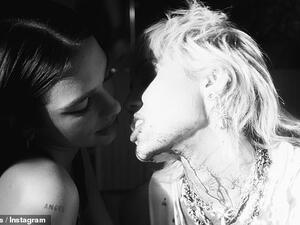Racy images: Miley Cyrus, right, took to Instagram late Thursday night to share a snap of herself teasing a kiss with Dua Lipa, left. (Instagram/ Miley Cyrus)