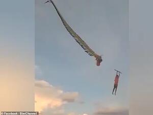 The boy began to fall when the dragon's head became detached from the body of the kite. A similar incident occurred in September when a 14-year-old boy fell after being lifted off the ground by a kite. (Facebook/ Video Screenshot)