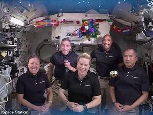 A can of mackerel donated by Japanese schoolgirls floats around the cabin as the crew of Expedition 64 ring in the Christmas holiday from aboard the International Space Station. (International Space Station)