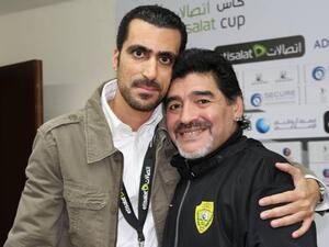 Tariq Al Sharabi poses with Diego Maradona. (Supplied photo)