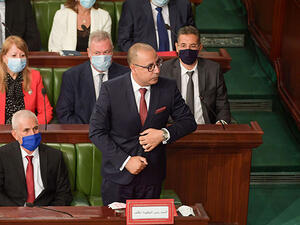 Hichem Mechichi, Prime Minister-designate of Tunisia, stands to deliver a speech to members of parliament in the capital Tunis on September 1. (AFP)
