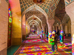 Lot of tourists taking photos in the interior of Nasir Al-Mulk Mosque (Pink Mosque) with colorful shining stained glass windows. (Shutterstock/ File Photo)