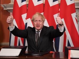 In this file photo taken on December 30, 2020 Britain's Prime Minister Boris Johnson gives a double thumbs up after signing the Trade and Cooperation Agreement between the UK and the EU, the Brexit trade deal, at 10 Downing Street in central London. Leon Neal / POOL / AFP