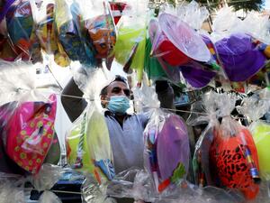 A vendor sells party supplies ahead of New Year on December 31, 2020 in Beirut. ANWAR AMRO / AFP